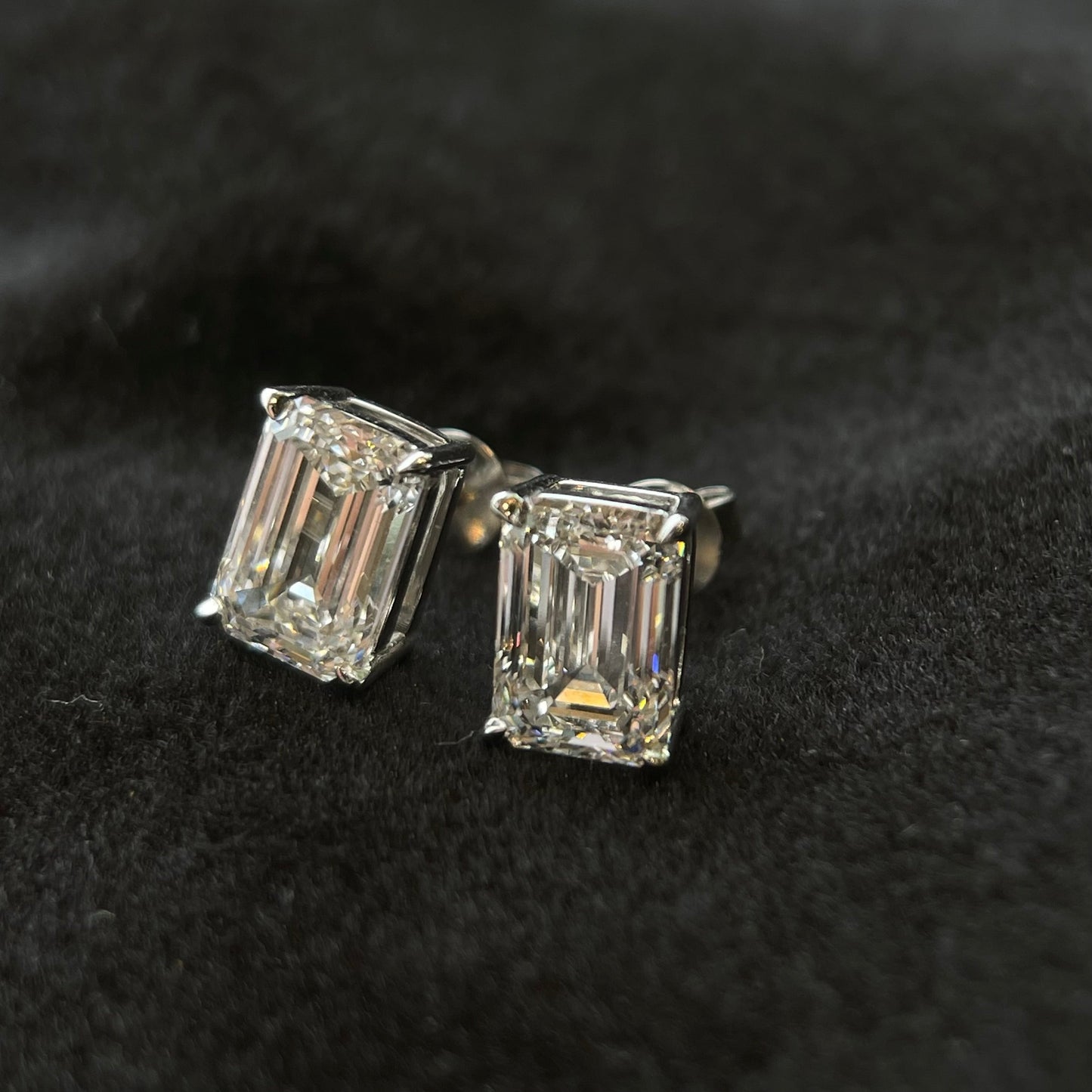 Emerald cut lab diamond stud earrings in platinum four-prong setting