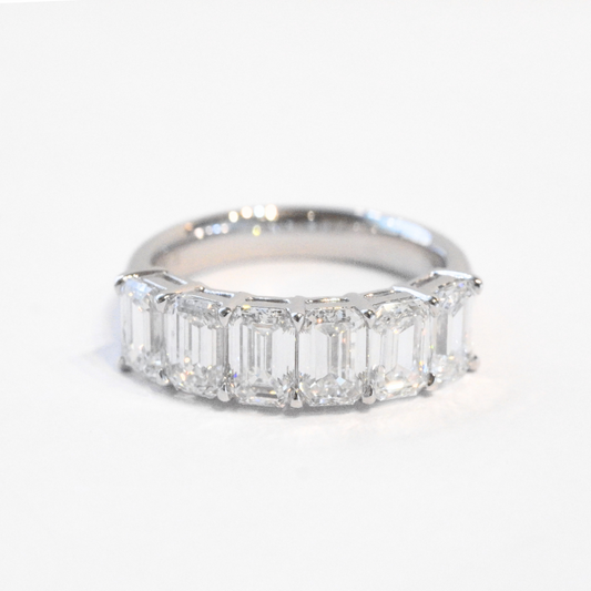 Emerald cut diamond half eternity ring